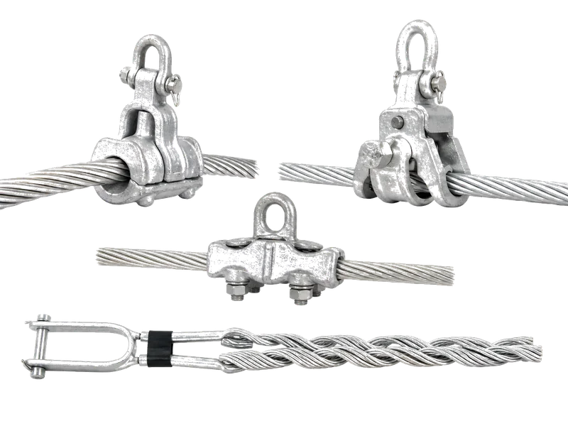 Galvanized suspension clamps, strain clamps, and vibration dampers arranged on a metal workbench