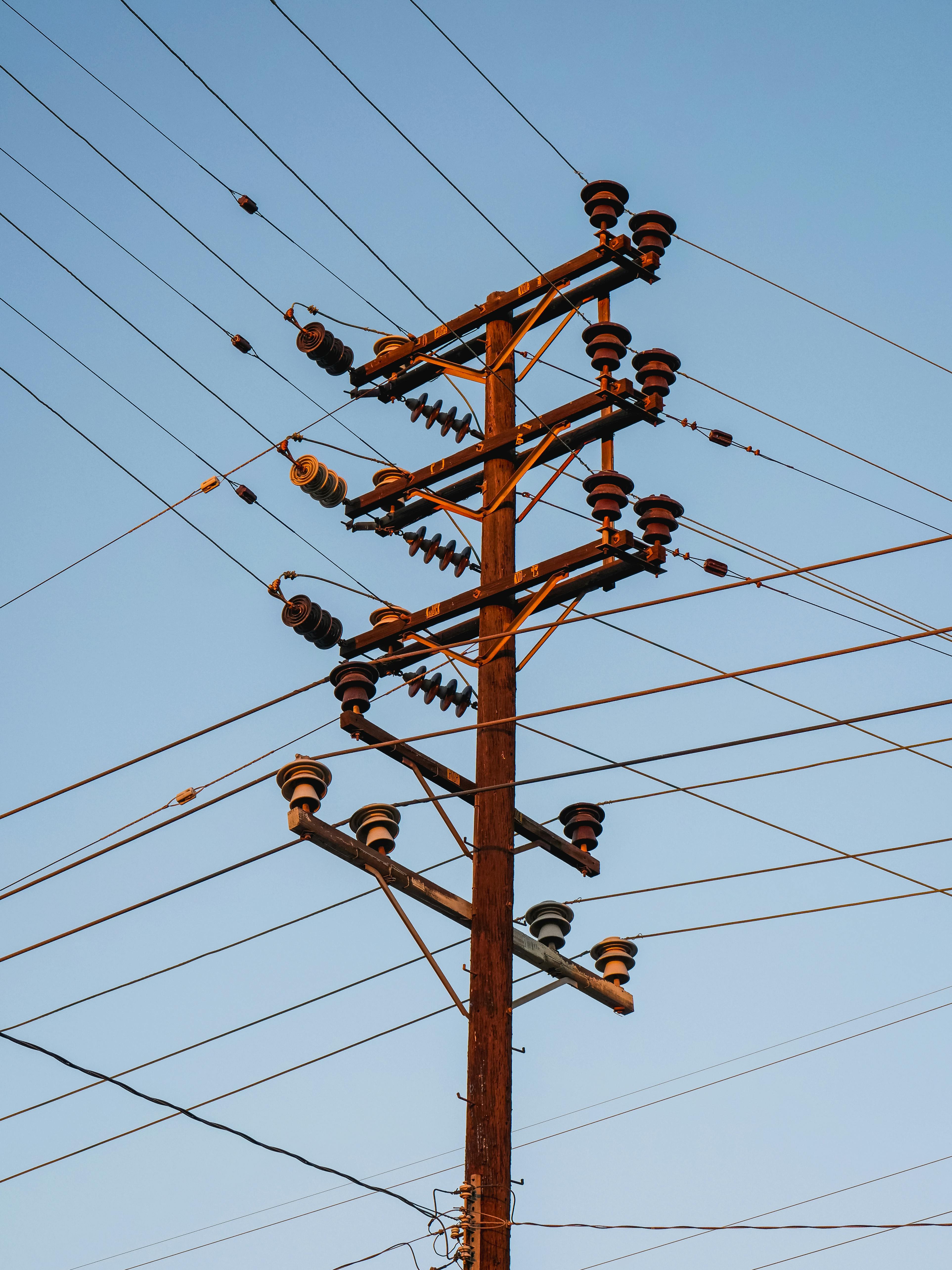 Low Angle Shot of Transmission Tower with Electric Lines