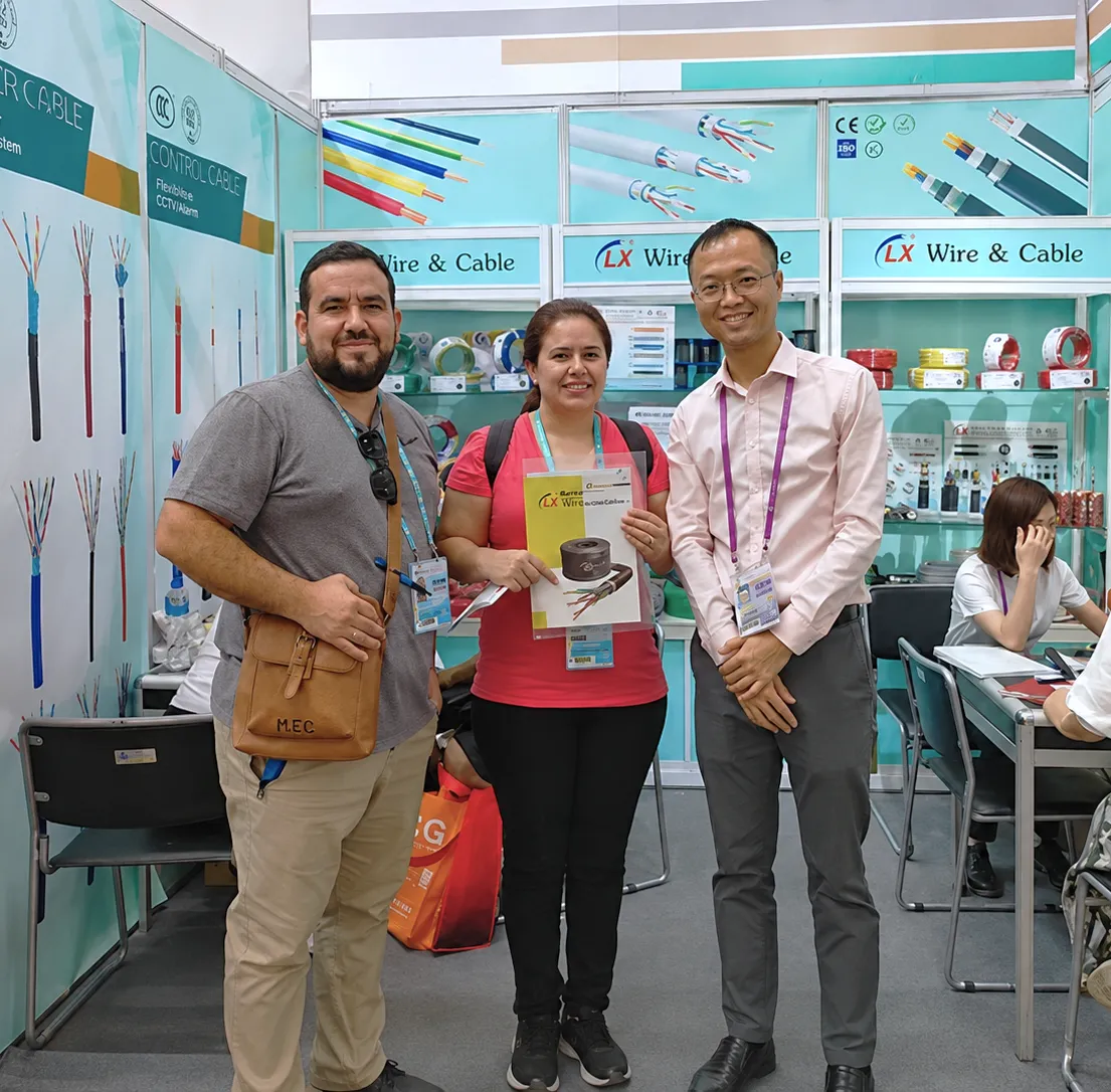LX Cable booth at an international trade show with visitors examining cable samples
